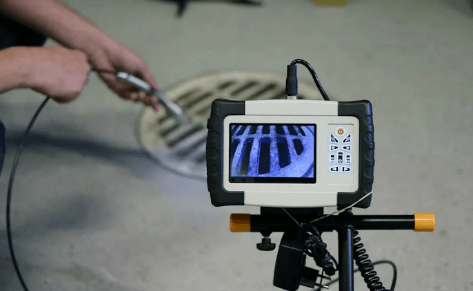 CCTV Drain Surveys Camden residential drain pipe to inspect for cracks or root damage.