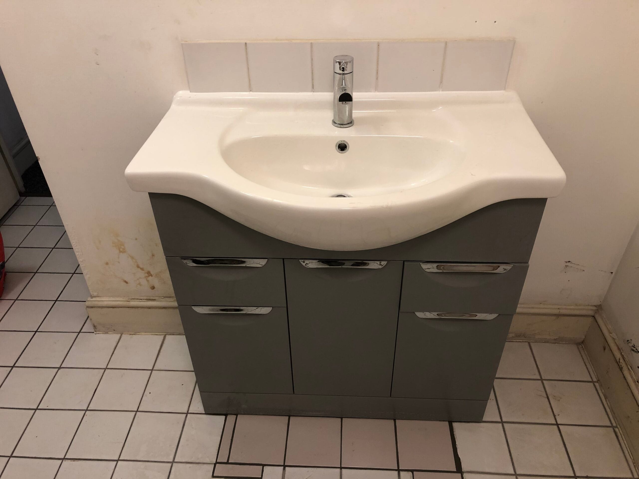 Bathroom vanity sink after unblocking