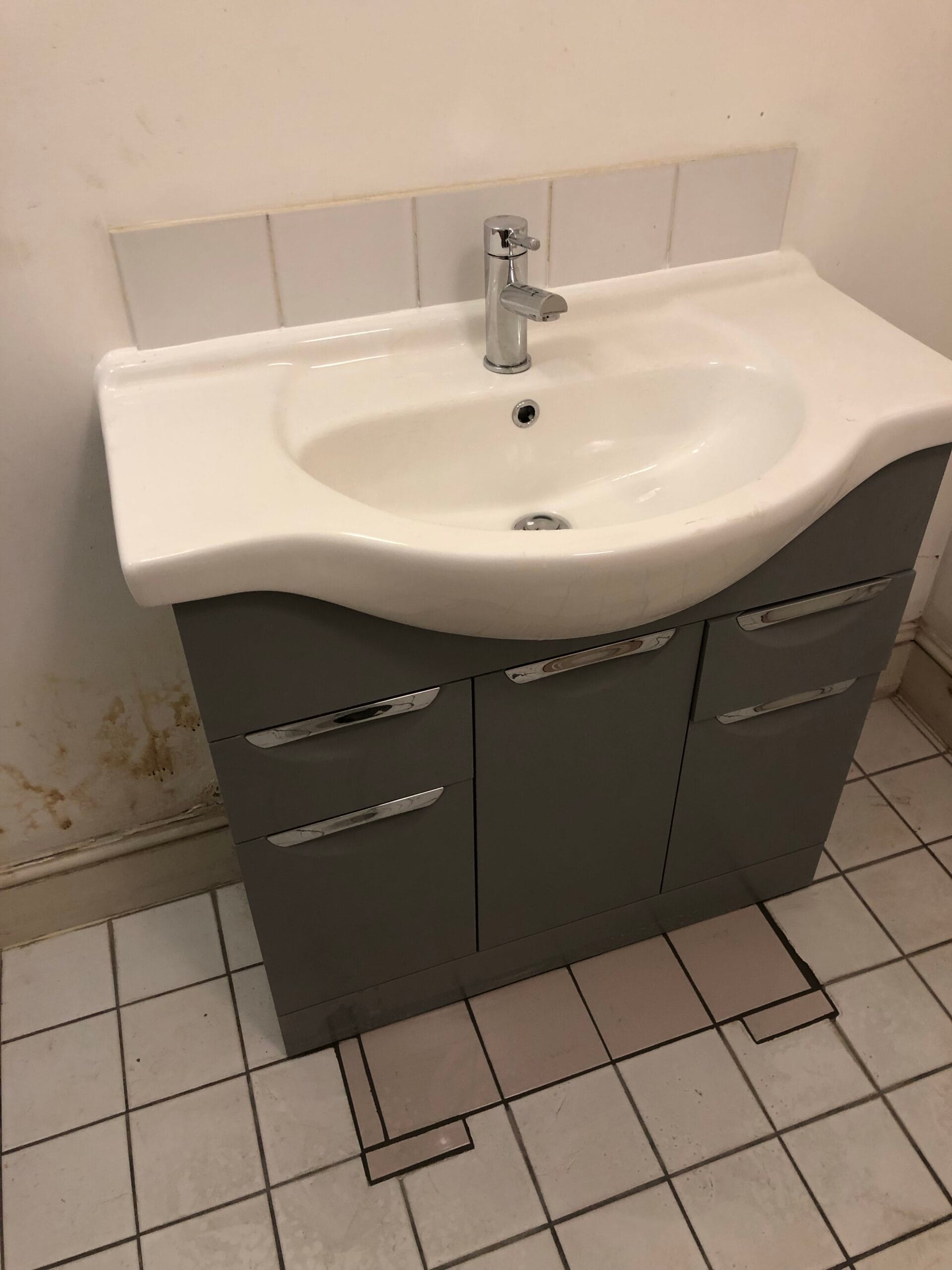 Bathroom basin and vanity after blockage clearance
