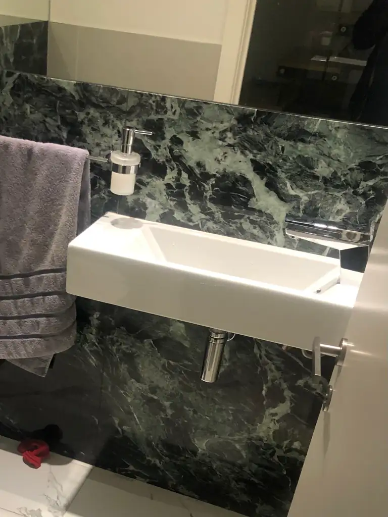 Wall-mounted bathroom sink after blockage clearance